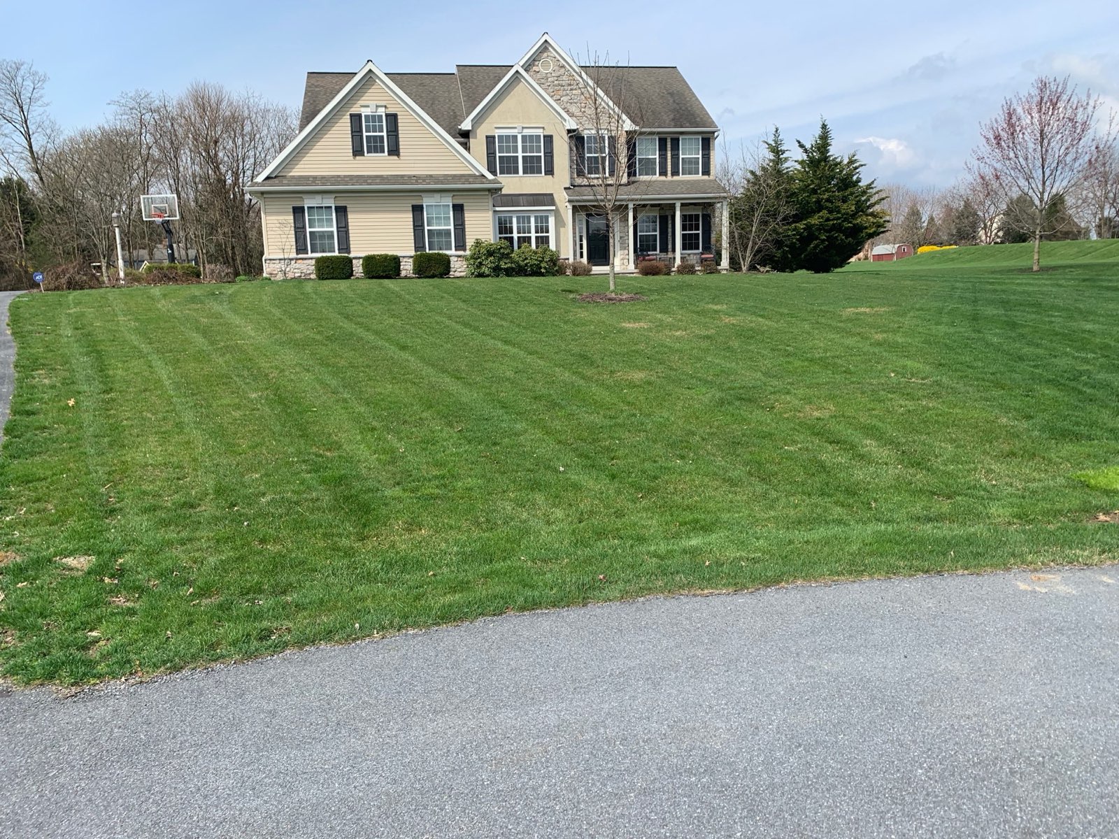 Even, green front lawn on a residential property in Central PA