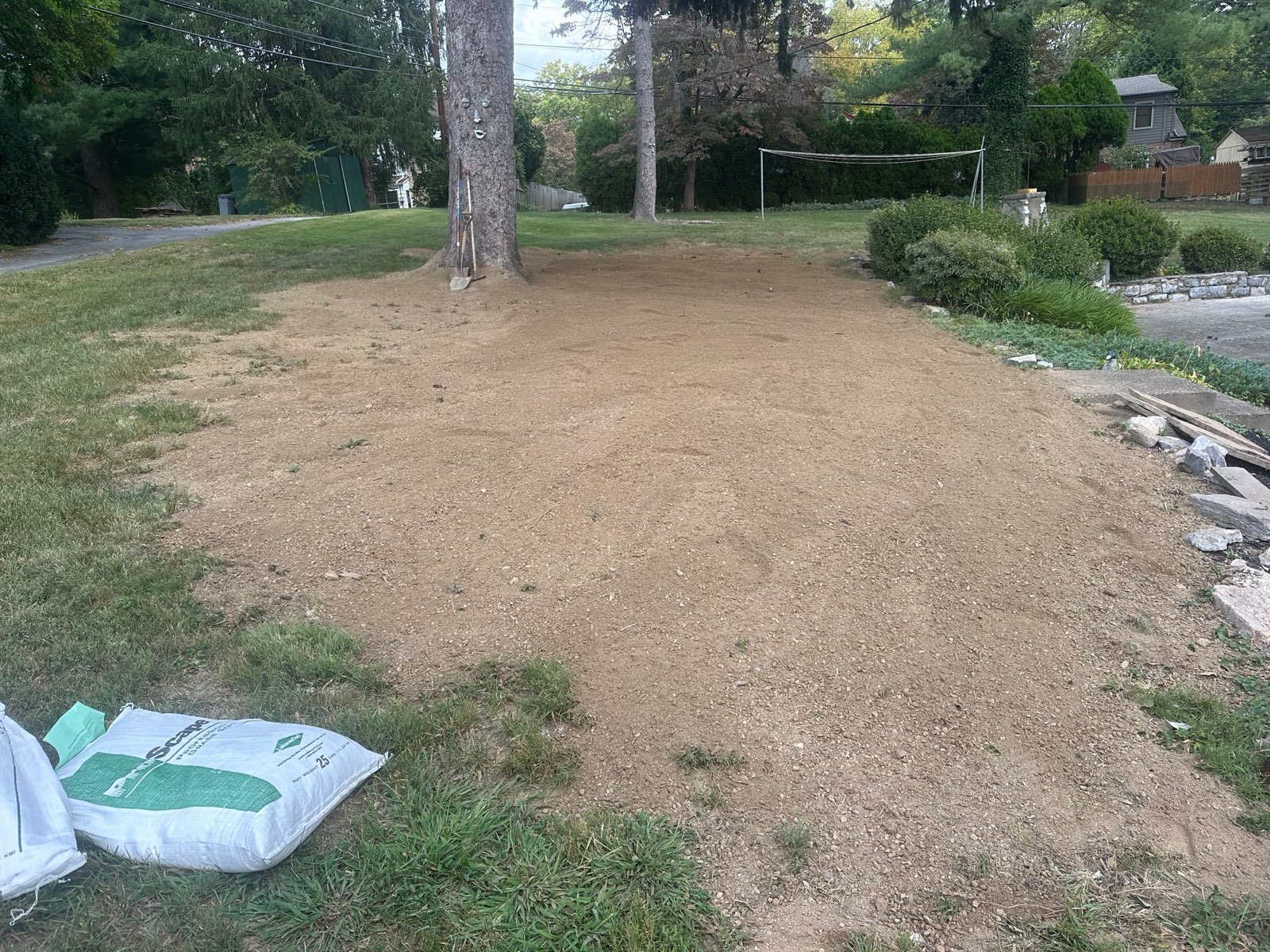 Bare, prepped soil ready for seed during a lawn renovation in Central PA
