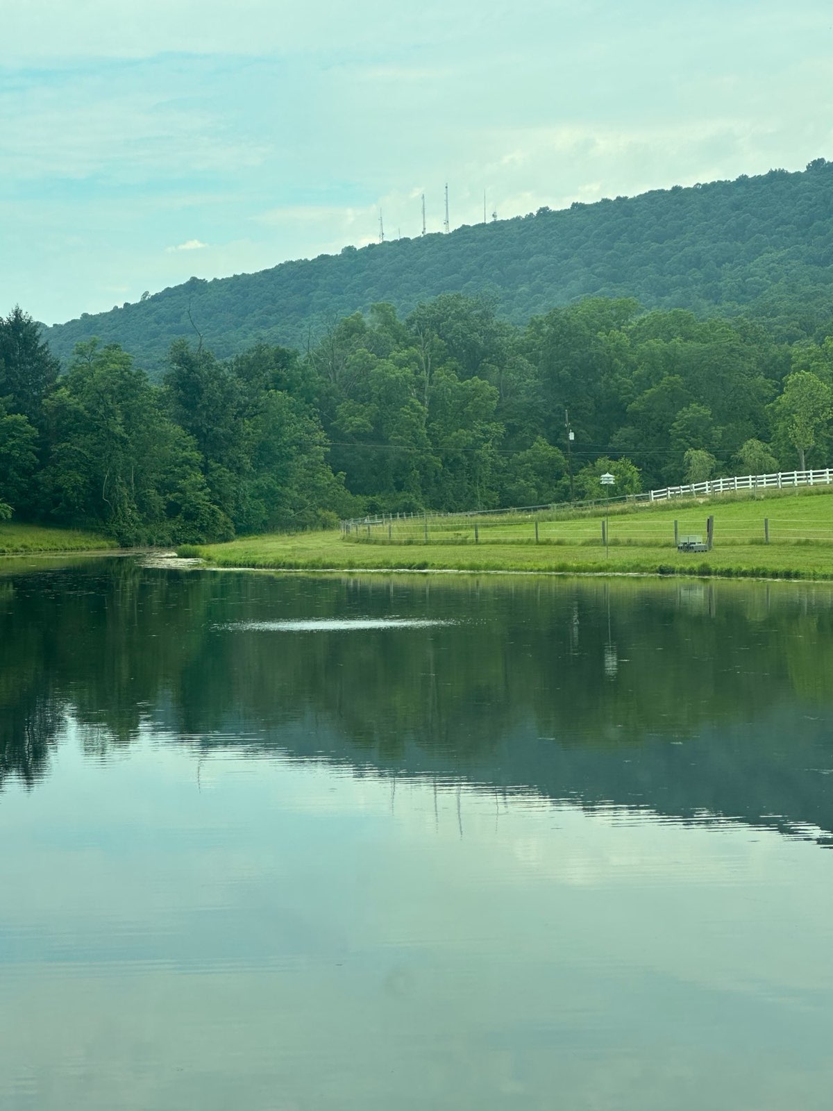 A pond below a wooded ridge in Central PA