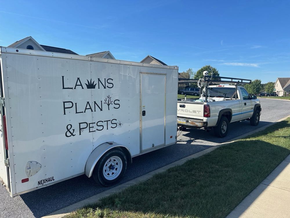 The Lawns Plants & Pests truck and trailer on a job in Central PA
